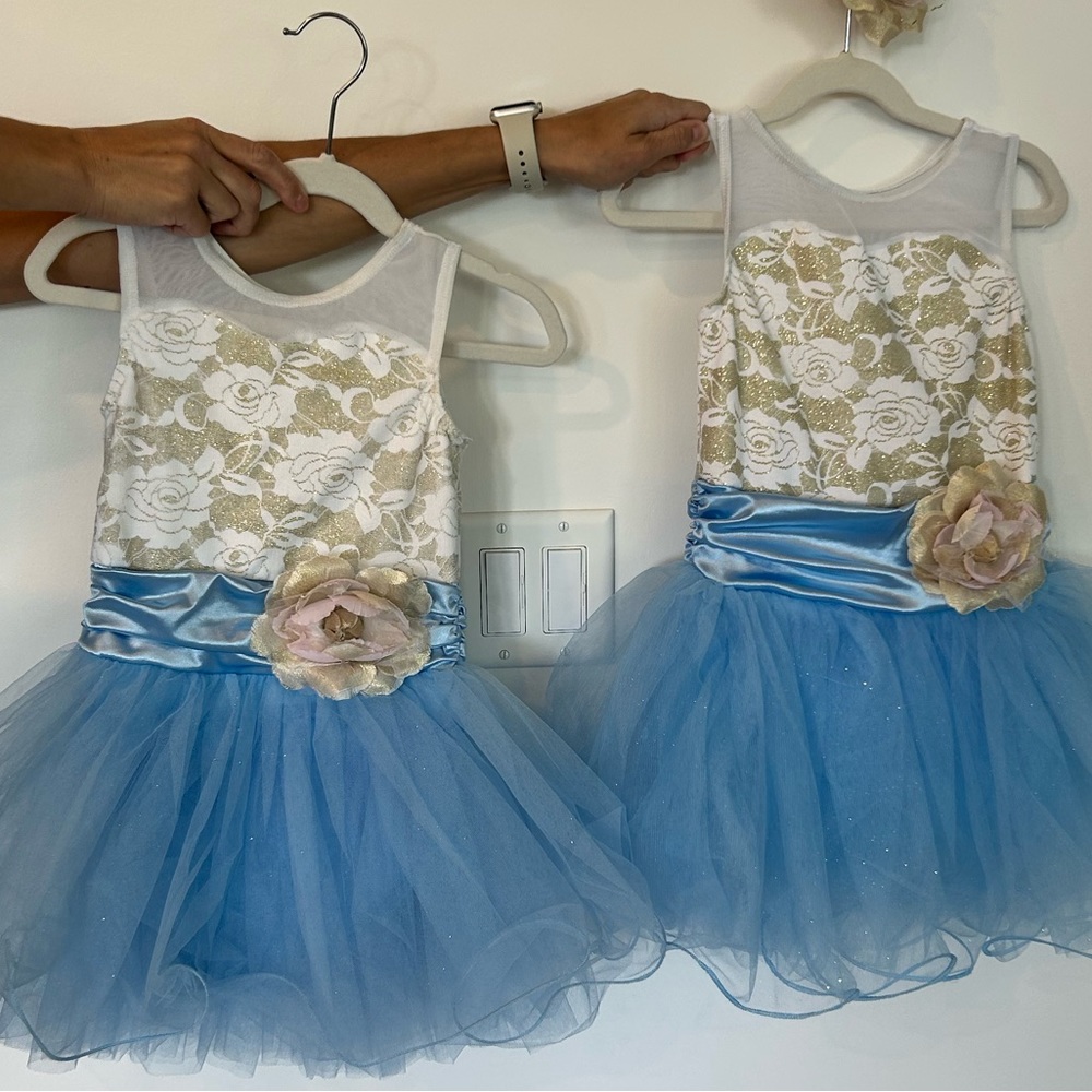 2- blue, white and gold dance costumes.